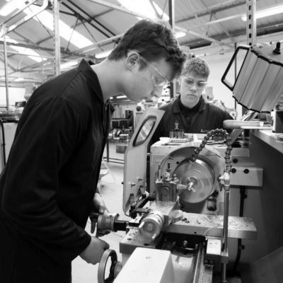 Technical Support Technician apprentice using machinery