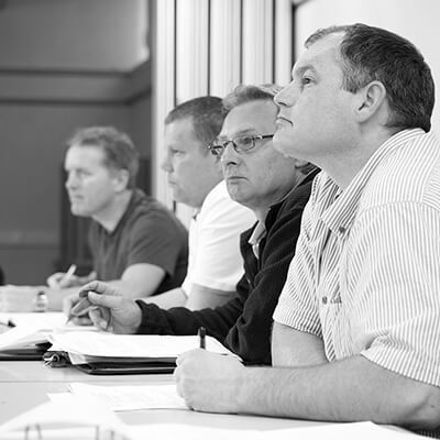 Students sitting in a classroom taking notes