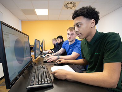Students working on CAD software on computers