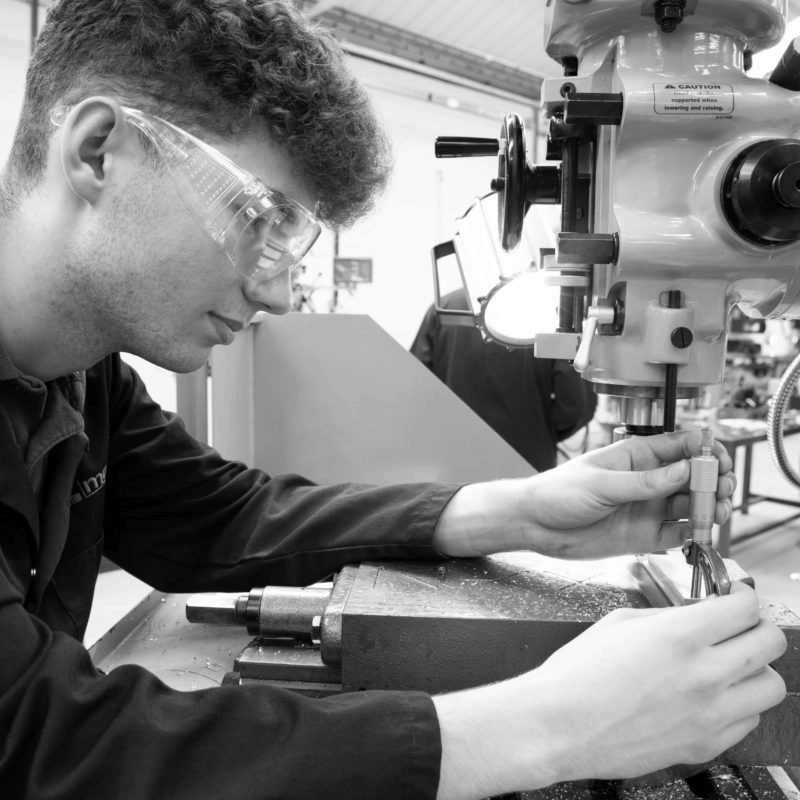 Toolmaker and Tool & Die Maintenance Technician apprentice inspecting a machined component