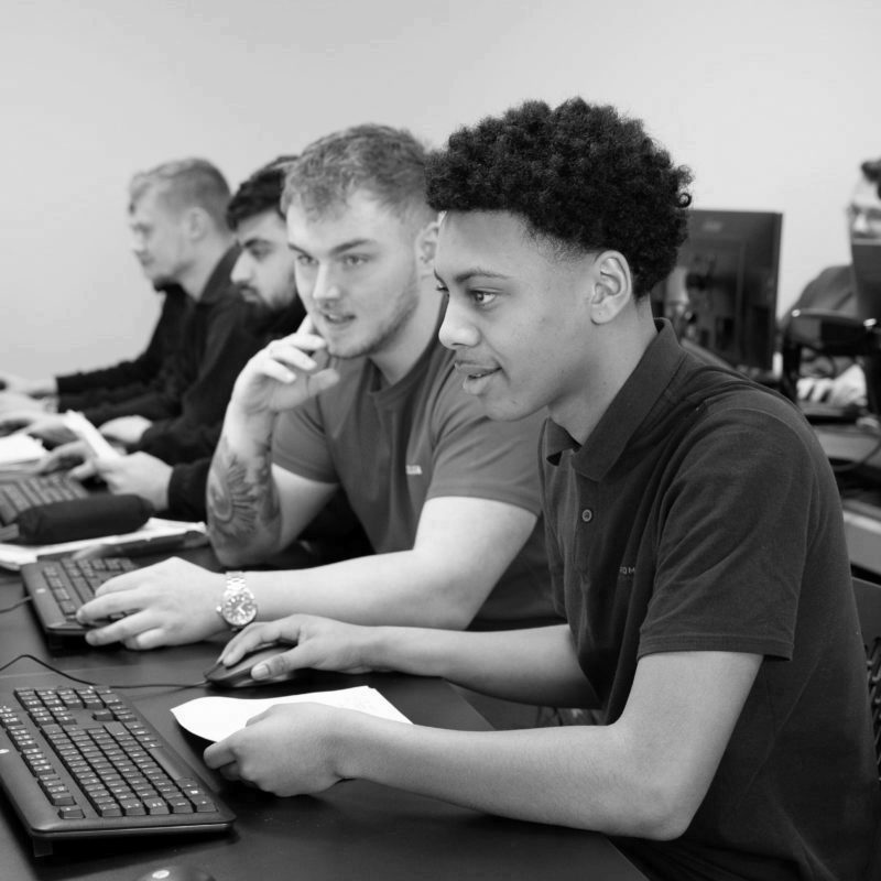 Two engineering apprentice working on computer