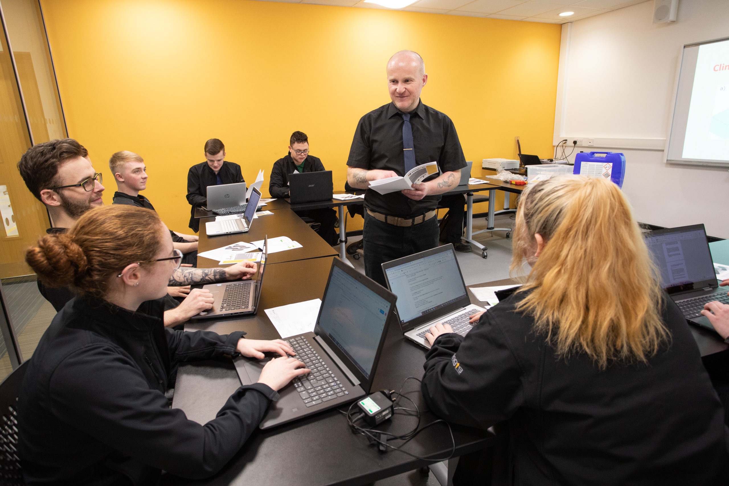 Apprentices listening to classroom lecture