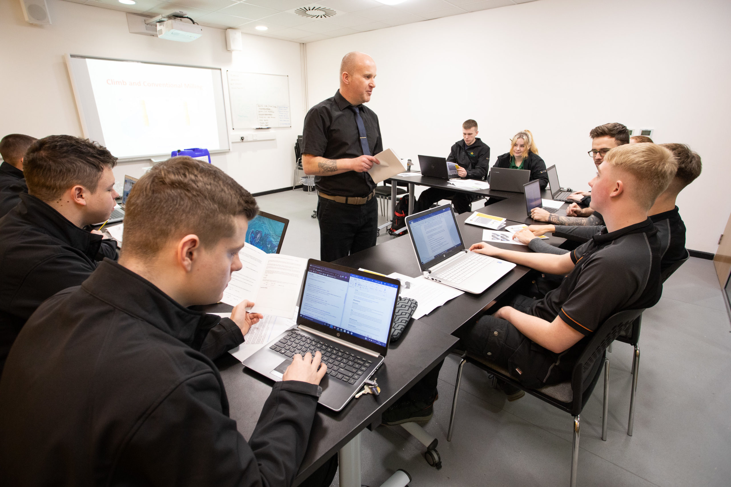 Male mentor giving classroom lecture to Food and Drink Engineering Maintenance Technician apprentices