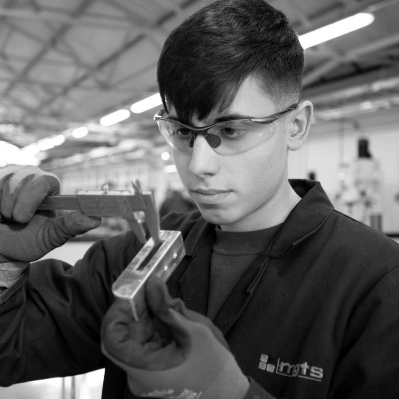 Product Design & Development Technician apprentice inspecting fitting
