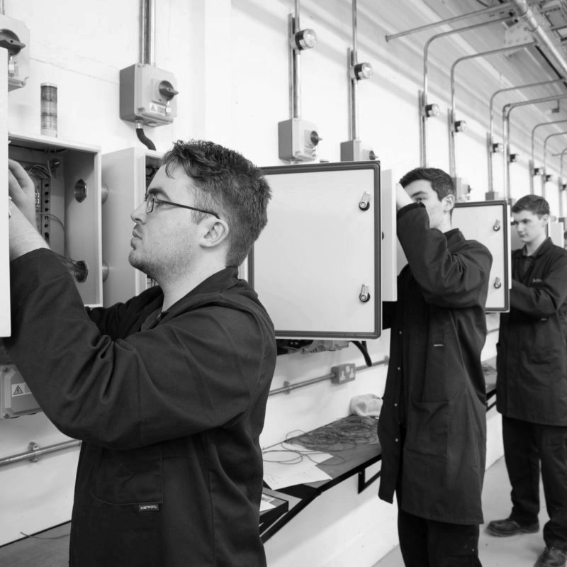 Product Design & Development Technician apprentices working on Electrical Installation and Motor Control